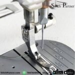 1. Quick-change presser foot holder for compatible garment stitching machines